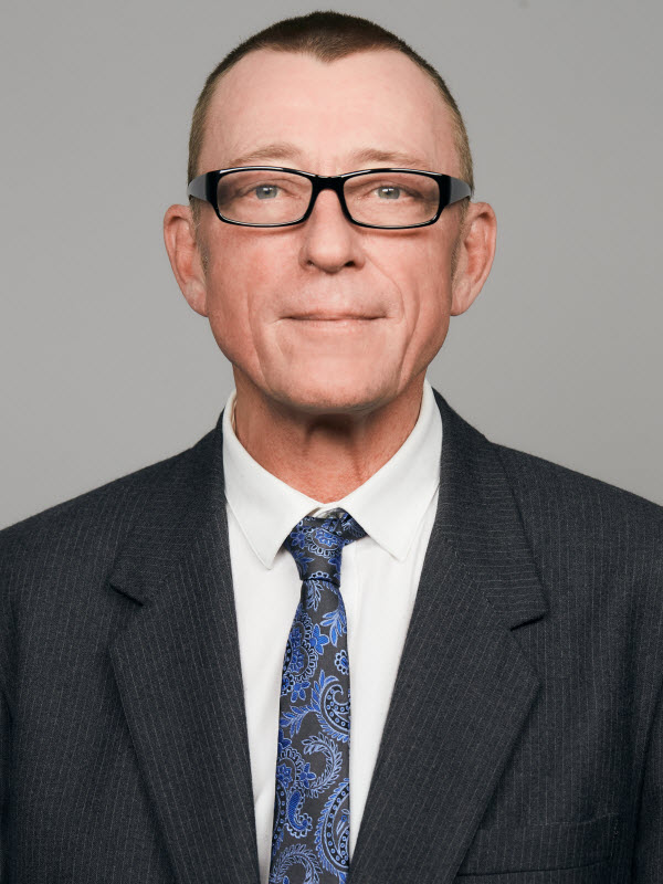 Man with eyeglasses wearing suit and tie